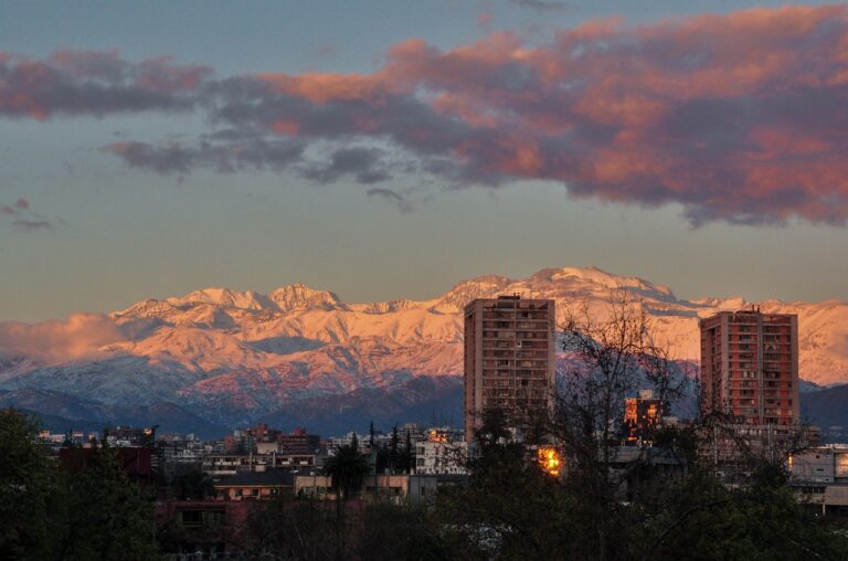 snowy mountain range, city, sunset-1699715.jpg